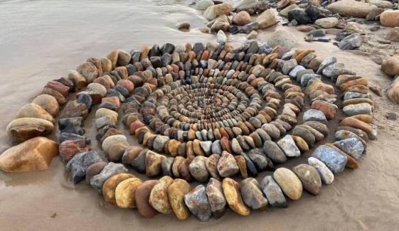 Mysterious artist behind stunning beach stone art finally revealed