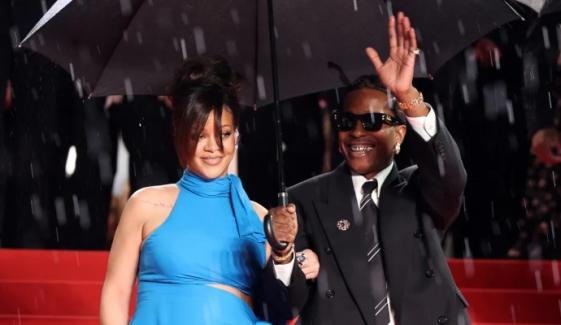 Rihanna turns heads in rain at Cannes, supporting A$AP Rocky’s big premiere