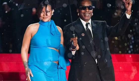 A$AP Rocky rushes through rain to join pregnant Rihanna after her father’s death