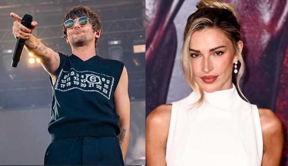 Zara McDermott sings along at boyfriend Louis Tomlinson’s Zurich show
