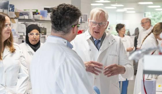 Duke of Gloucester wears white lab coat during recent visit 