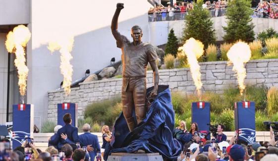 Tom Brady ‘frozen in time’ with bronze statue at Gillette Stadium