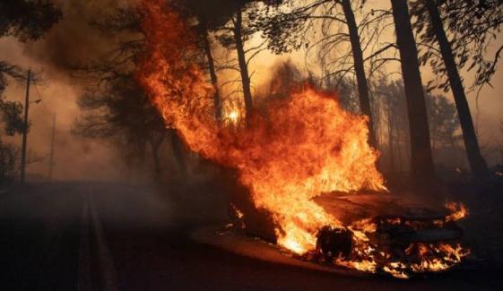 Deadly wildfire near Athens continues to rage as hundreds of firefighters battle blaze