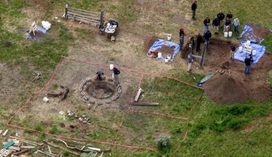 Manhunt for alleged killer halts after bones found near 3 daughters' bodies