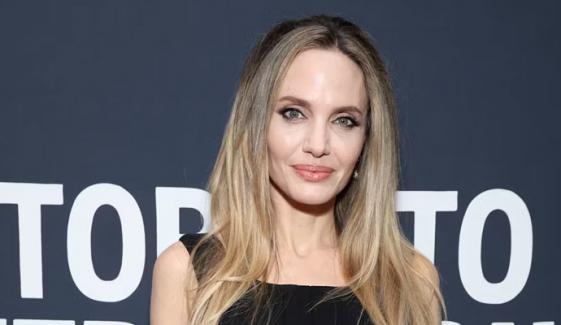 Angelina Jolie braves rain at San Sebastian Film Festival in velvet black gown