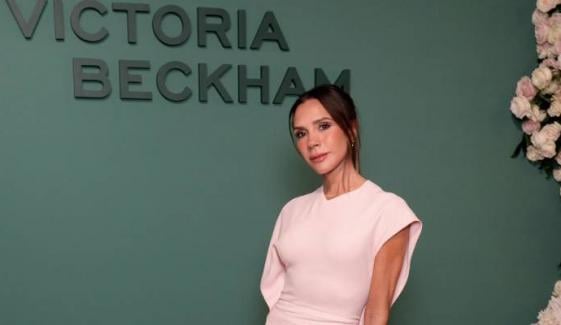 Victoria Beckham exudes glamour in chic pink dress at special event