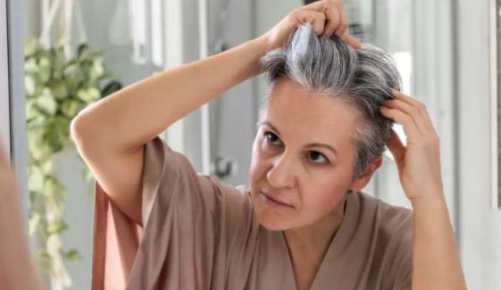 Your gray strands might be saving you from skin cancer
