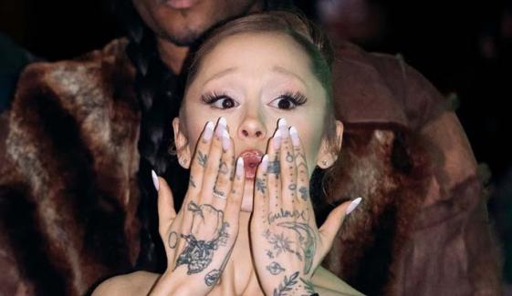 Ariana Grande shows off her 40 hand tattoos at Wicked event