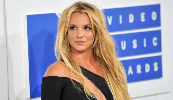 Britney Spears sparks concern by walking with Champagne flute