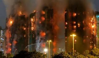Hong Kong fire leaves four dead as massive blaze engulfs residential buildings