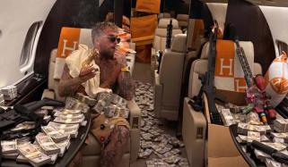 Jake Paul flaunts wealth, guns on private jet in post Joshua defeat stunt