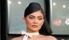 Kylie Jenner flaunts fit figure in gold metallic bikini