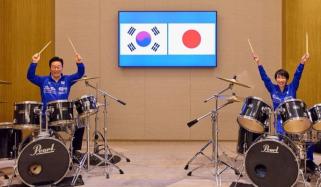 South Korea, Japan's leaders perform K-pop drum duet after diplomatic talks