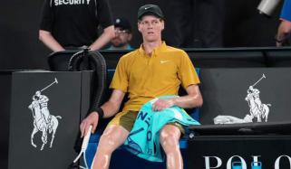Sinner survives extreme conditions to keep Australian Open defense alive