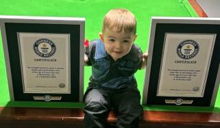 Two-year-old snooker prodigy sets world records for trick shots 