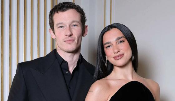 Dua Lipa reacts after paparazzi disrupt cozy Paris date with Callum Turner 
