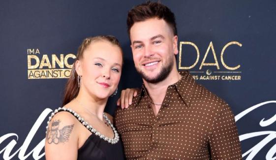 JoJo Siwa turns heads at brother's wedding with beau Chris Hughes