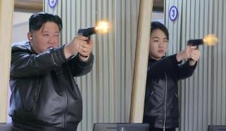 Kim Jong Un tests guns with daughter at arm factory, new hint at succession