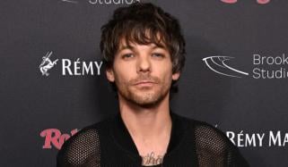 Louis Tomlinson dishes on One Direction songs he loved & hated