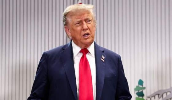 Trump shares AI image with rifle, issues warning to Iran: ‘No more Mr. Nice Guy’