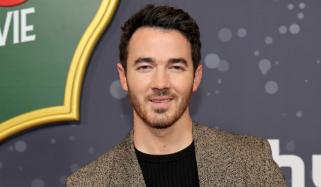 Kevin Jonas sends temperature soaring with shirtless workout clip