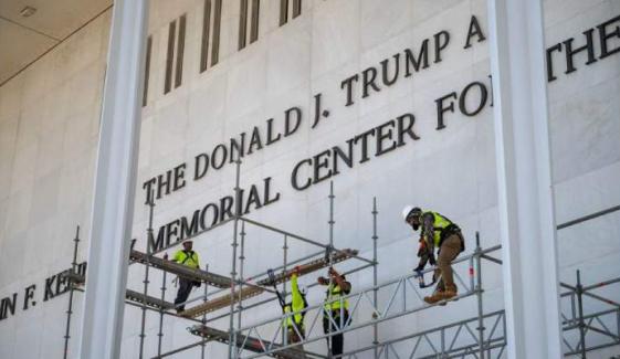Kennedy Center crowds gather as workers strip Trump’s name from facade