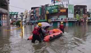 Japan: Four injured, more than 100 flights cancelled as twin storms close in 