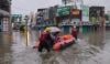 Japan: Four injured, more than 100 flights cancelled as twin storms close in 