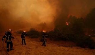 Nearly 270,000 evacuated as wildfires rage across Spain and France