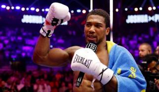 Anthony Joshua recovers from two knockdowns to knock out Kristian Prenga, pays tribute to late friends