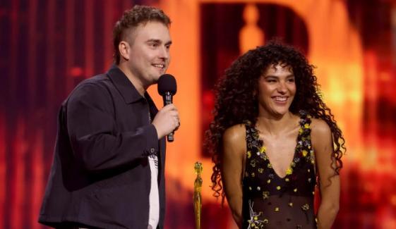 Olivia Dean, Sam Fender reunite to perform ‘Rein Me In’ as it breaks decade-old record