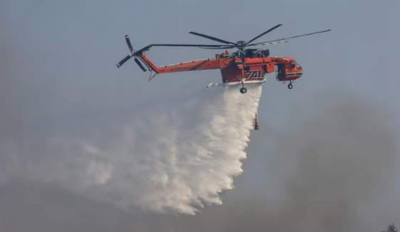 Greece wildfires: Two firefighting helicopters collide amid widespread blazes