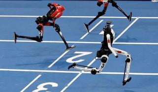 Humanoid robot nearly crashes into camera crew at Beijing World Robot Games