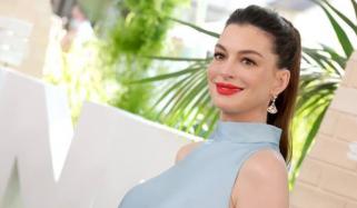Anne Hathaway puts growing baby bump on display in recent outing