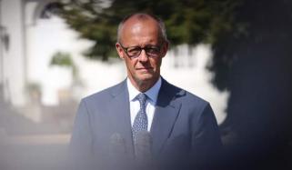 Merz vows to stay German chancellor after CDU suffers historic defeat