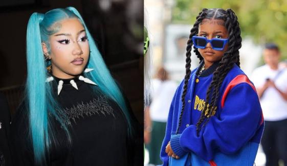 Everything about North West's fake piercings, long blue hair and cyberpunk fashion