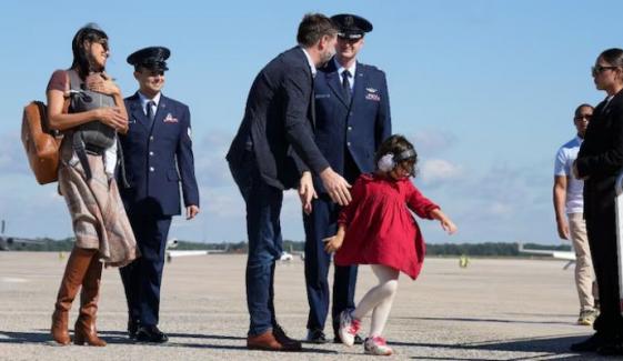 Shocking moment Usha Vance nearly falls exiting helicopter holding baby