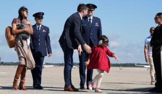Shocking moment Usha Vance nearly falls exiting helicopter holding baby