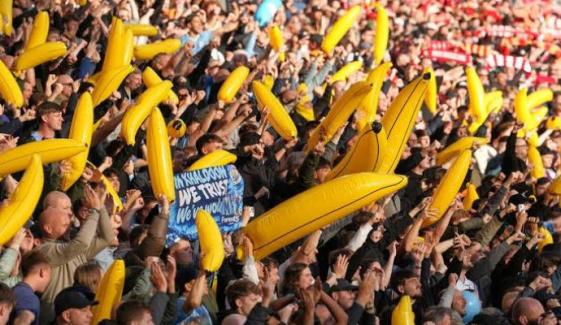 Man City fans wave inflatable bananas at Anfield in defiant display amid financial scandal