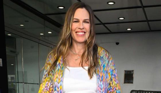 Hilary Swank flaunts her baby bump as she slams backlash over having child at 52