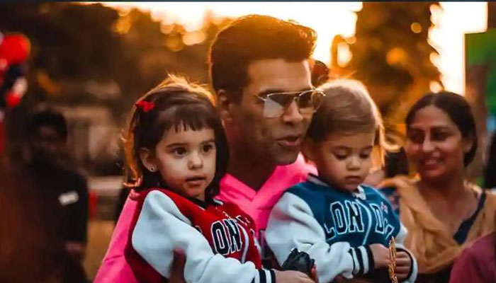 Karan Johar embrace kids Yash and Roohi as he wishes fans New Year