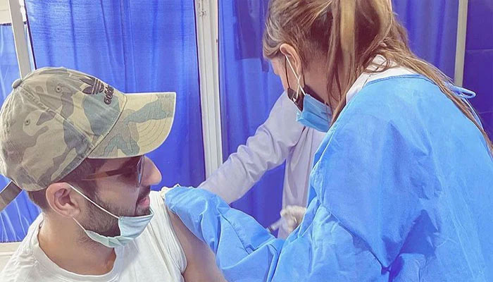 Muneeb Butt gets first dose of COVID-19 vaccine