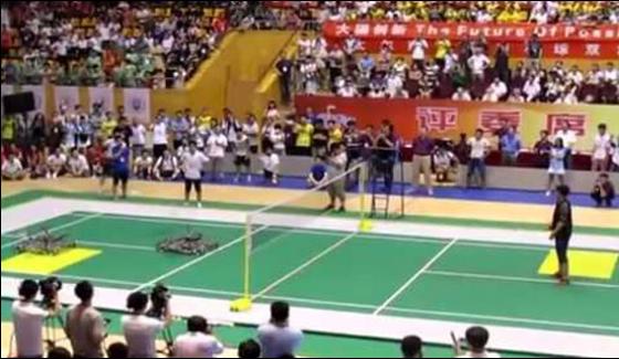 Woman Plays Badminton With Robot In China