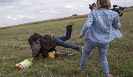 Hungarian Woman Journalist Over Kicking Syrian Refugee