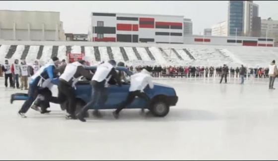 Vehicle Pushing Competition On The Icy Surface In Russia