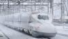 Japanese Train On Snow Tracks