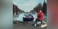 Russian Strongman Pulls Wheelspinning Car