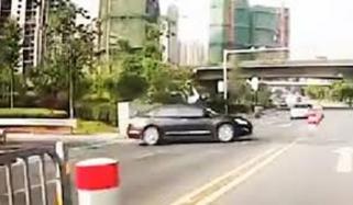 Lucky Motorcyclist Lands On Feet After Crashing Into Car In China