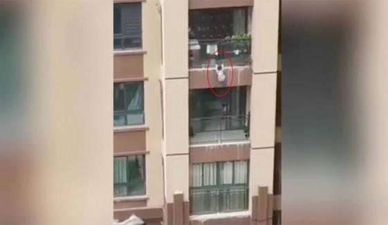 Locals Use Duvets To Catch Boy Falling From Balcony In China