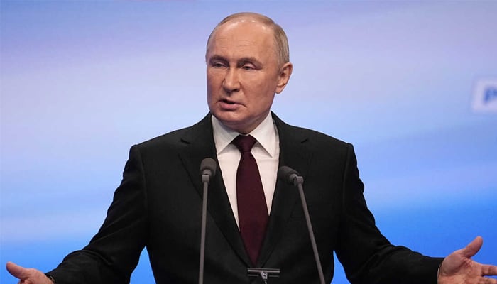 Vladimir Putin makes a statement after wining reelection